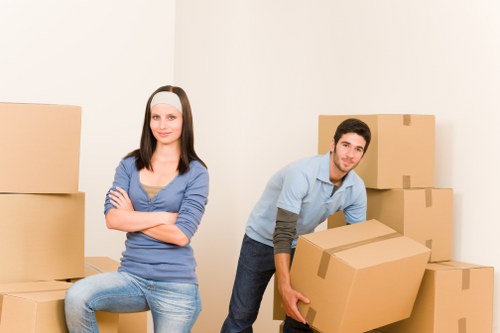 Staff preparing desks and boxes for office removals in Norbury